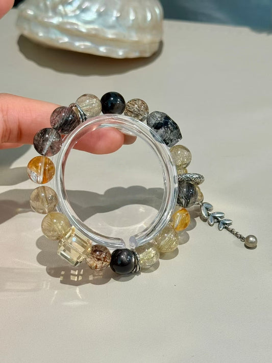 The Alchemist's Treasure: Golden Rutilated Quartz & Black Stone Bracelet for Transformation